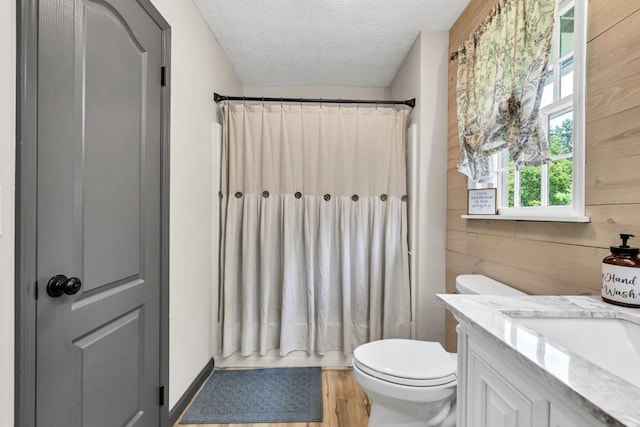 6127 Yellow Creek Rd, Murrayville, GA 30564 - bathroom featuring toilet, wooden walls, a textured ceiling, vanity, and a shower with shower curtain