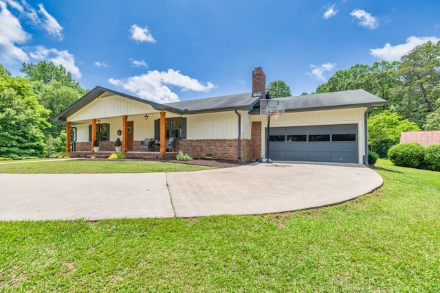 6127 Yellow Creek Rd, Murrayville, GA 30564 - view of front of house with a chimney, a garage, a porch, a front yard, and driveway