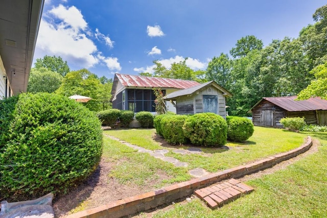 6127 Yellow Creek Rd, Murrayville, GA 30564 - view of home's exterior featuring a yard, an outdoor structure, and metal roof