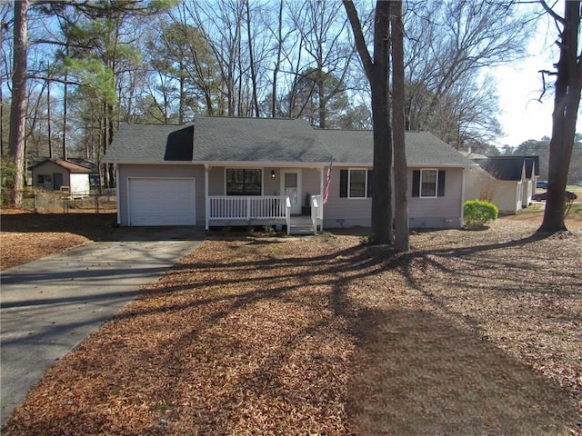 single story home with a porch and a garage