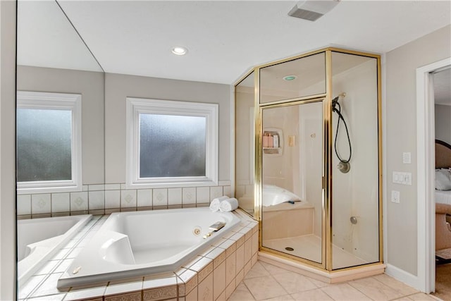 ensuite bathroom with tile patterned flooring, a tub with jets, a shower stall, and ensuite bathroom