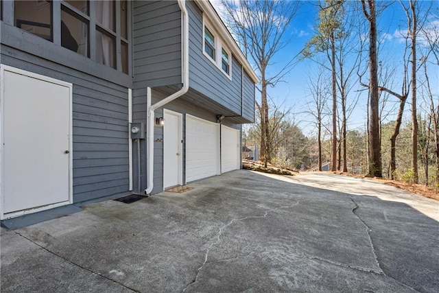 view of side of home featuring a garage