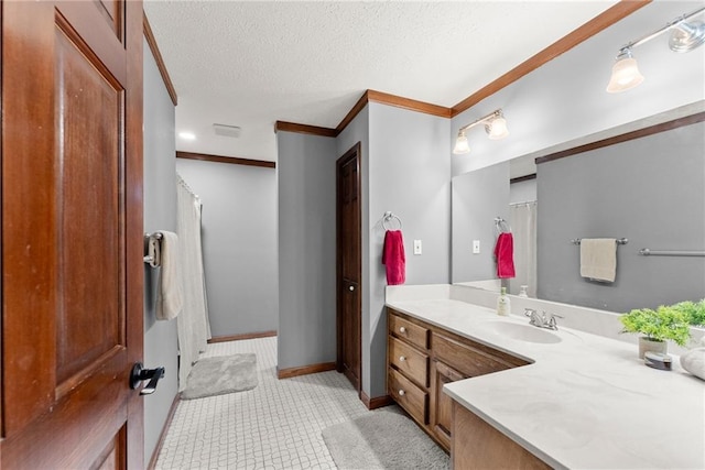 bathroom featuring baseboards, vanity, curtained shower, a textured ceiling, and crown molding