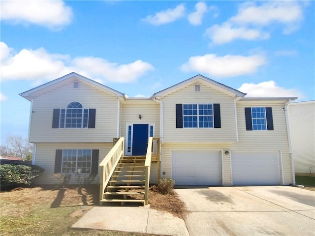 view of front of house with a garage and concrete driveway