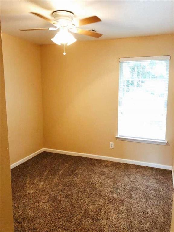 301 Brookview Dr, Riverdale, GA 30274 - spare room with ceiling fan and dark carpet