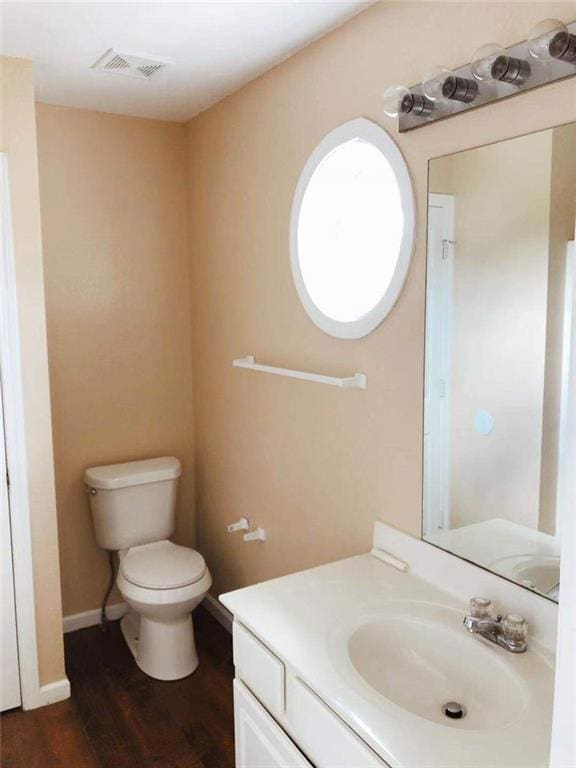 301 Brookview Dr, Riverdale, GA 30274 - bathroom featuring vanity and wood finished floors