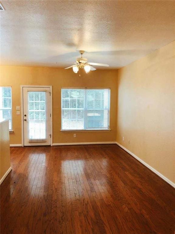 301 Brookview Dr, Riverdale, GA 30274 - unfurnished room featuring a ceiling fan, hardwood / wood-style floors, plenty of natural light, and a textured ceiling