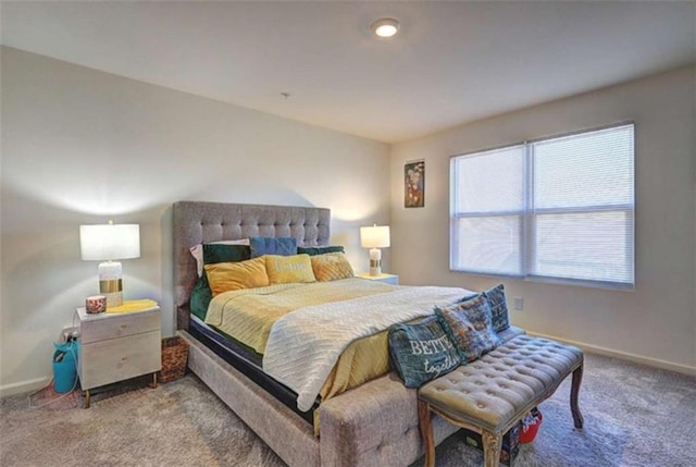 bedroom with carpet flooring and baseboards