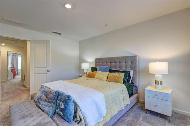 carpeted bedroom featuring recessed lighting, baseboards, and visible vents