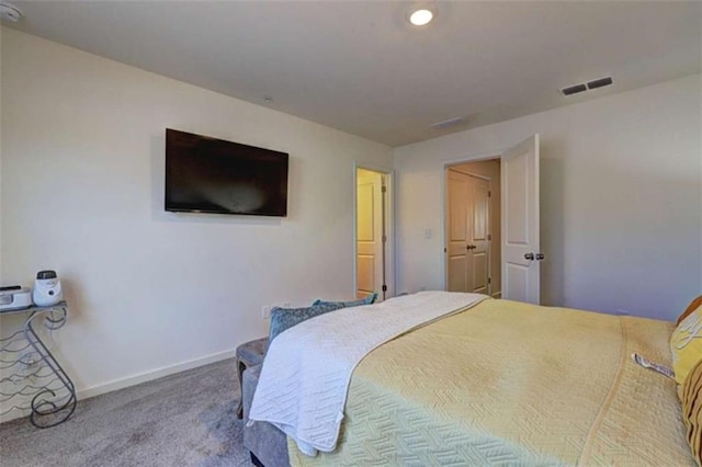 carpeted bedroom featuring visible vents and baseboards