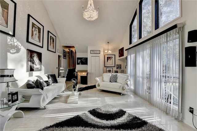 tiled living room with high vaulted ceiling and an inviting chandelier