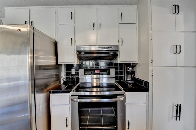 kitchen featuring white cabinetry, stainless steel appliances, and tasteful backsplash