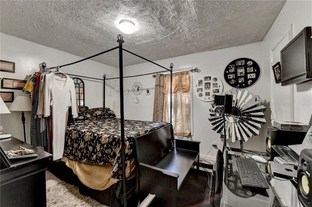 bedroom featuring a textured ceiling