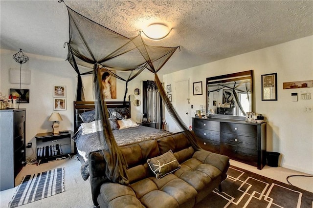 carpeted bedroom with a textured ceiling