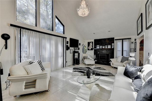 tiled living room with a notable chandelier and high vaulted ceiling