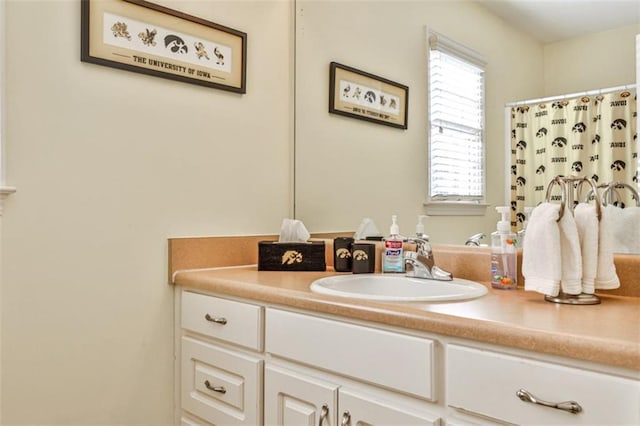 bathroom with vanity and a shower with shower curtain