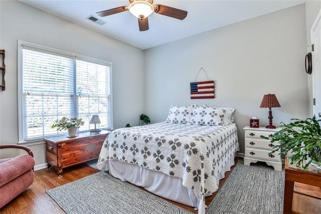 bedroom featuring light hardwood / wood-style floors and ceiling fan