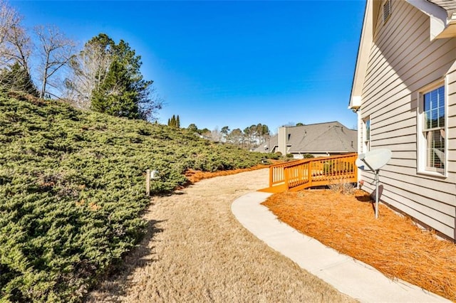 view of yard featuring a deck