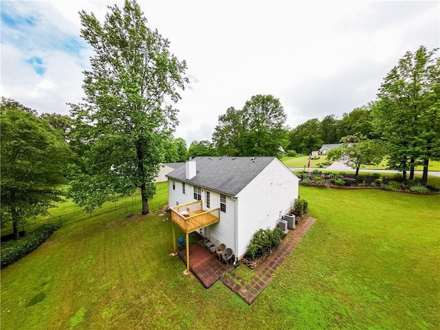 1444 Elliotts Ln, Auburn, GA 30011 - view of home's exterior with a yard, a wooden deck, a chimney, cooling unit, and view of scattered trees