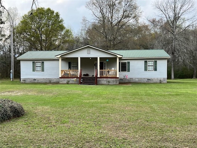 manufactured / mobile home with a porch and a front lawn