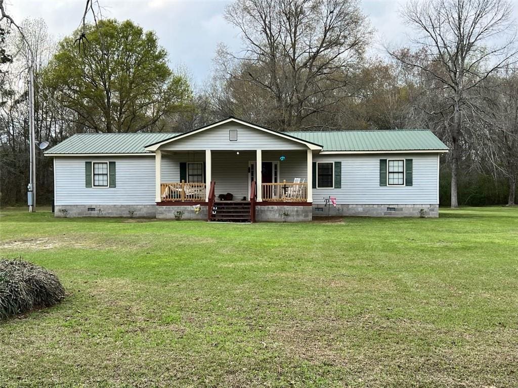 manufactured / mobile home with metal roof, crawl space, a front lawn, and covered porch