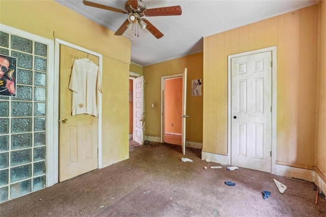 unfurnished bedroom with carpet, ceiling fan, and ornamental molding