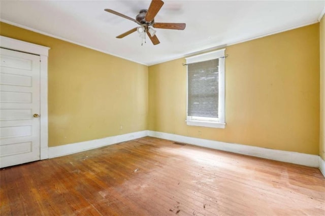 unfurnished room featuring hardwood / wood-style floors and ceiling fan