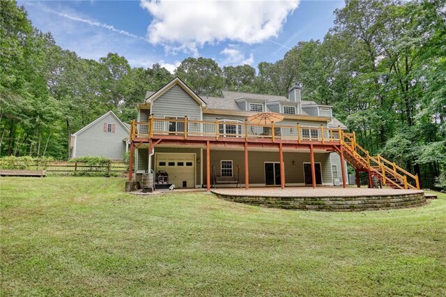 116 Woolsey Creek Trl, Fayetteville, GA 30215 - back of house with a deck, stairs, an attached garage, and a patio