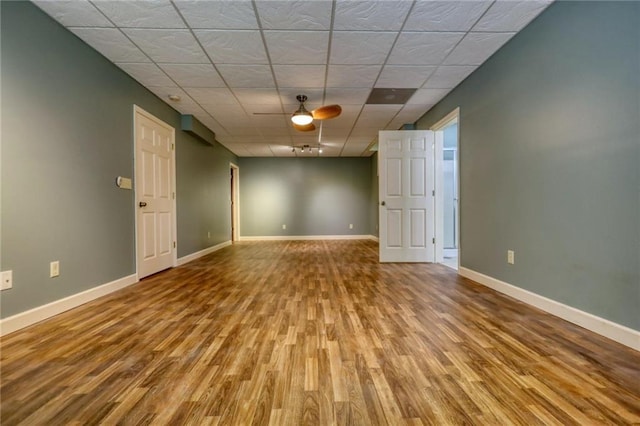 116 Woolsey Creek Trl, Fayetteville, GA 30215 - spare room featuring wood finished floors, ceiling fan, baseboards, and a paneled ceiling