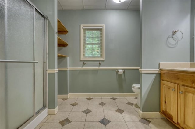 116 Woolsey Creek Trl, Fayetteville, GA 30215 - bathroom featuring a shower stall, baseboards, vanity, a drop ceiling, and toilet