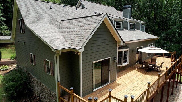 116 Woolsey Creek Trl, Fayetteville, GA 30215 - back of property with outdoor dining area, a deck, a chimney, and a shingled roof