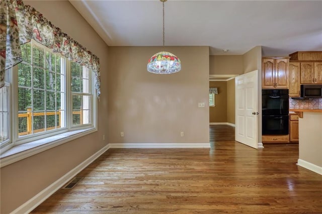 116 Woolsey Creek Trl, Fayetteville, GA 30215 - unfurnished dining area with wood finished floors and baseboards