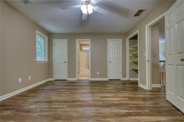 116 Woolsey Creek Trl, Fayetteville, GA 30215 - unfurnished bedroom featuring baseboards, ensuite bathroom, wood finished floors, and a ceiling fan