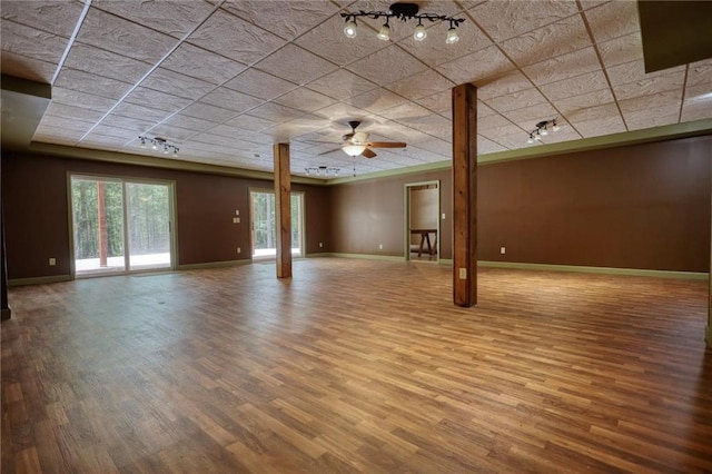 116 Woolsey Creek Trl, Fayetteville, GA 30215 - unfurnished living room featuring wood finished floors, baseboards, rail lighting, and ceiling fan
