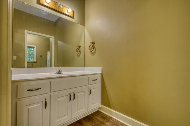 116 Woolsey Creek Trl, Fayetteville, GA 30215 - bathroom with wood finished floors, baseboards, and vanity