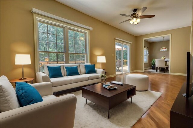 116 Woolsey Creek Trl, Fayetteville, GA 30215 - living area featuring wood finished floors, ceiling fan, and baseboards