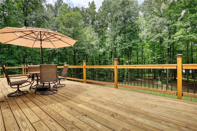 116 Woolsey Creek Trl, Fayetteville, GA 30215 - wooden deck featuring outdoor dining area and view of wooded area