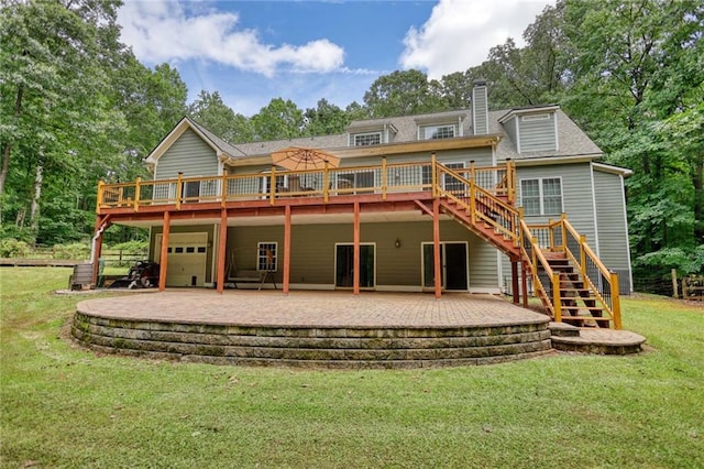 116 Woolsey Creek Trl, Fayetteville, GA 30215 - back of property with a wooden deck, stairs, a garage, a chimney, and a yard