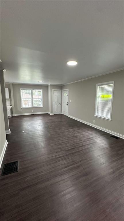 15 Harlan Rd, Atlanta, GA 30311 - unfurnished living room featuring baseboards, dark wood-style flooring, crown molding, and recessed lighting