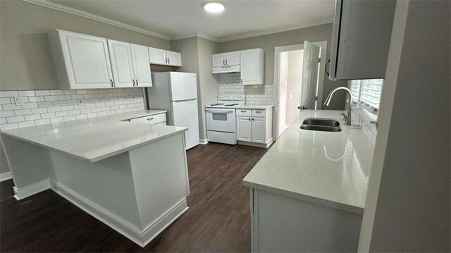 15 Harlan Rd, Atlanta, GA 30311 - kitchen with white appliances, a sink, a peninsula, decorative backsplash, and dark wood-type flooring
