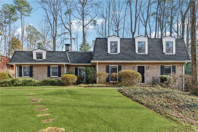 new england style home with a front yard