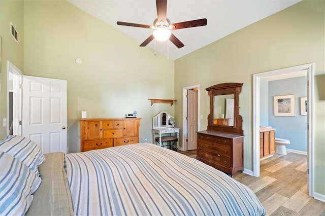 bedroom featuring light wood finished floors, visible vents, ceiling fan, high vaulted ceiling, and baseboards