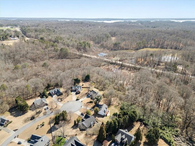 aerial view with a wooded view