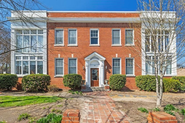 view of front of home featuring brick siding