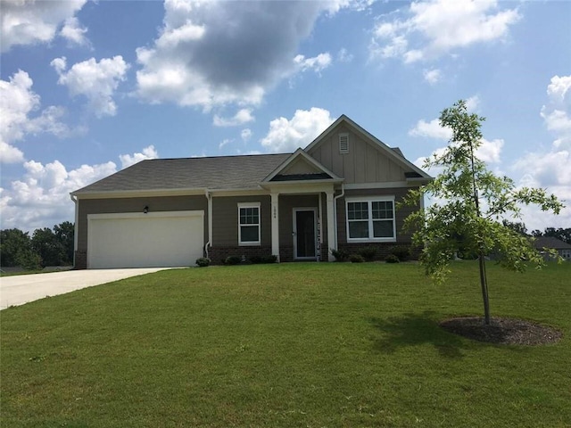 craftsman inspired home with a garage and a front yard