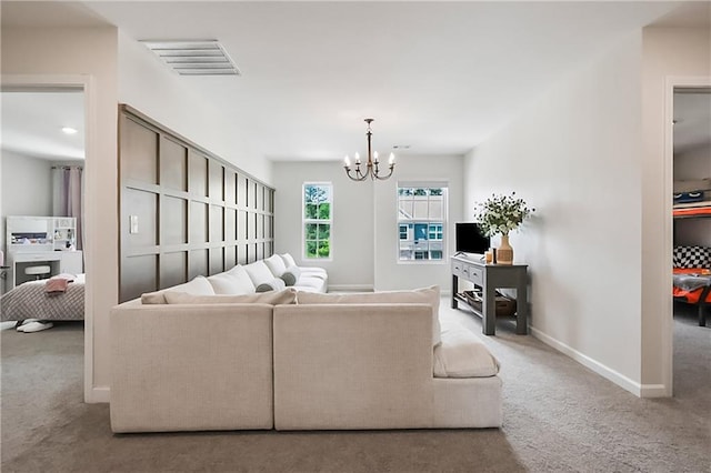 108 Wildflower Trce, Dallas, GA 30132 - living room with carpet floors, a chandelier, and baseboards