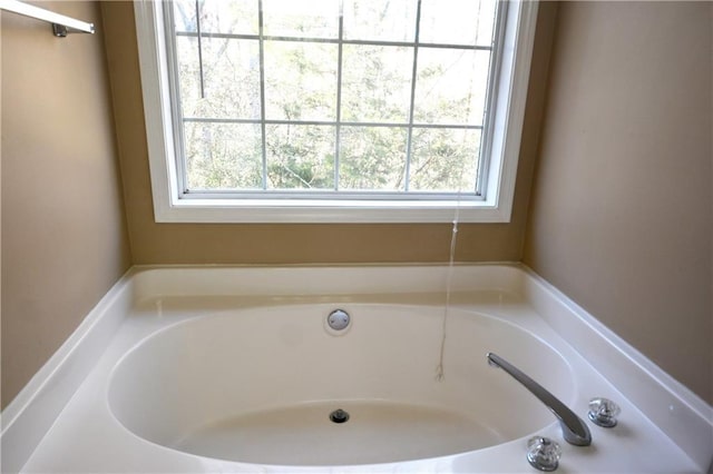 bathroom featuring a tub