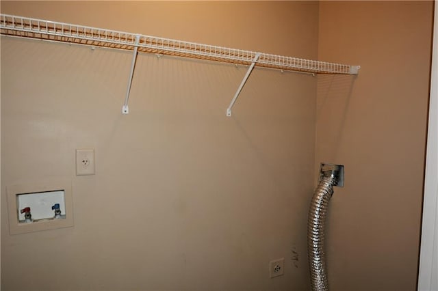 washroom with washer hookup and hookup for an electric dryer