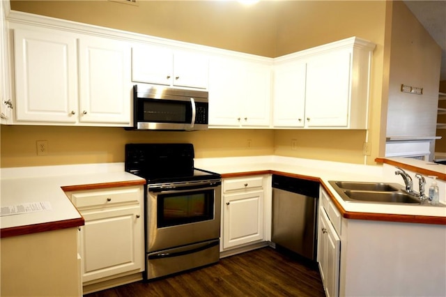 kitchen with white cabinetry, sink, dark hardwood / wood-style flooring, and stainless steel appliances