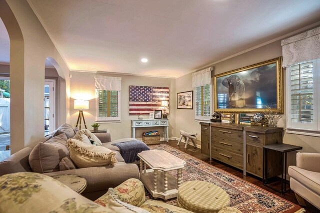 2195 Edison Ave NE, Atlanta, GA 30305 - living room featuring arched walkways, crown molding, and wood finished floors